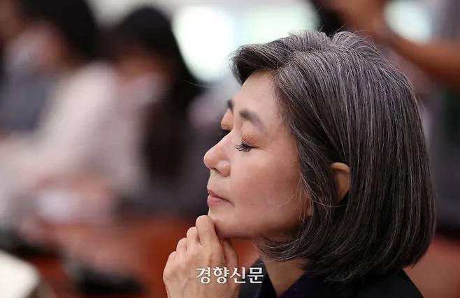 Kim Haeng, nominee for the minister of gender equality and family, rests her chin in her hand as she listens to a question in her confirmation hearing at the National Assembly on October 5. Bak Min-gyu, Senior Reporter