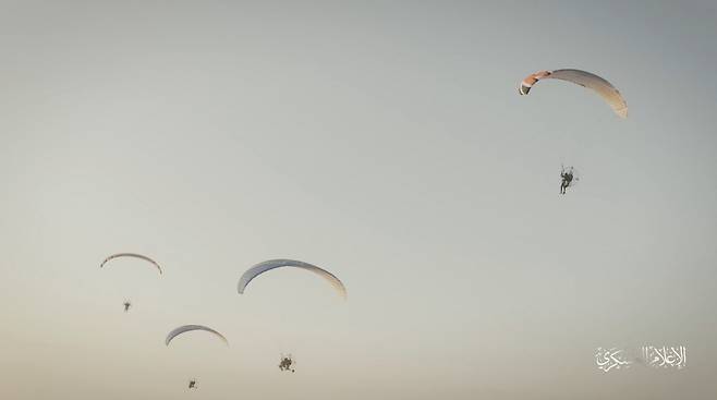 Hamas's armed wing IIzz el-Deen al-Qassam Brigades train with paragliders as they prepare for an armed air assault, in this screengrab obtained from a social media video released by Izz el-Deen al-Qassam Brigades on October 7. (Reuters)