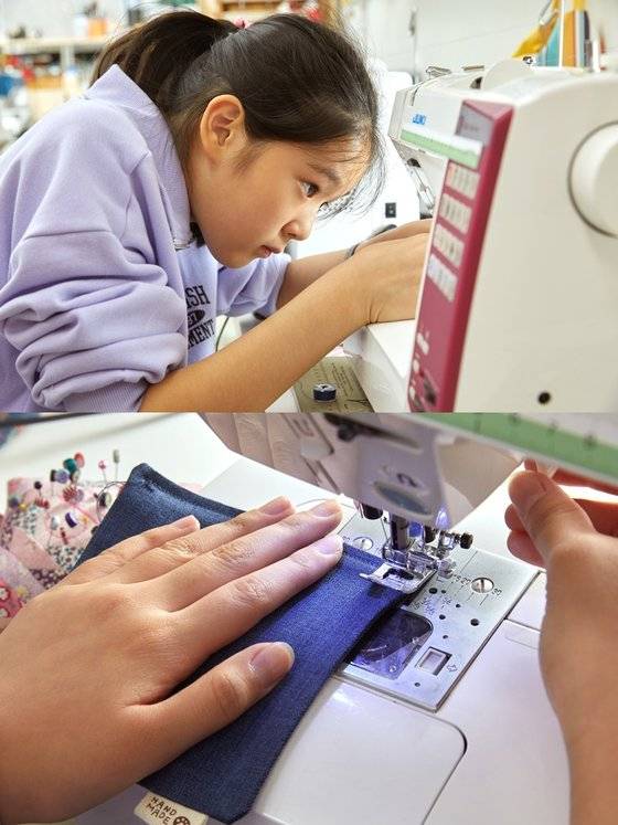 티매트 창구멍을 재봉틀로 박음질하고 있는 이유민 학생기자.