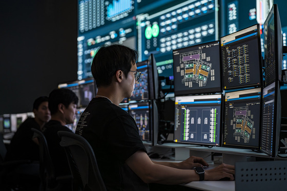 Naver engineers looks at monitors in Control Center [NAVER]