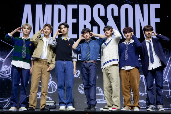 Ampers&One, FNC Entertainment's new seven-member boy band, poses for the camera during its debut showcase at the Blue Square in Yongsan District, central Seoul. [FNC ENTERTAINMENT]