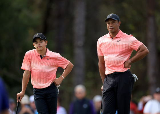 Tiger Woods and his son Charlie Woods wait to putt on the third hole during the first round of the 2022 PNC Championship at The Ritz-Carlton Golf Club on Dec. 17, 2022 in Orlando, Florida. [GETTY IMAGES]