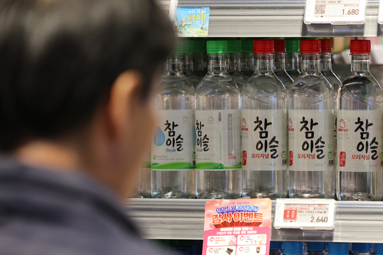 Bottles of soju are on display at a supermarket in Seoul. [YONHAP]