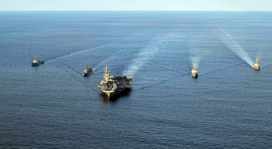 The aircraft carrier USS Carl Vinson, center, leads a group of South Korean, U.S. and Japanese destroyers for a trilateral exercise south of Jeju Island on Nov. 26. On the left of the USS Carl Vinson is the USS Kidd and the JS Kirisame, while on the right is the ROKS Sejong the Great and the USS Sterett. [U.S. NAVY]