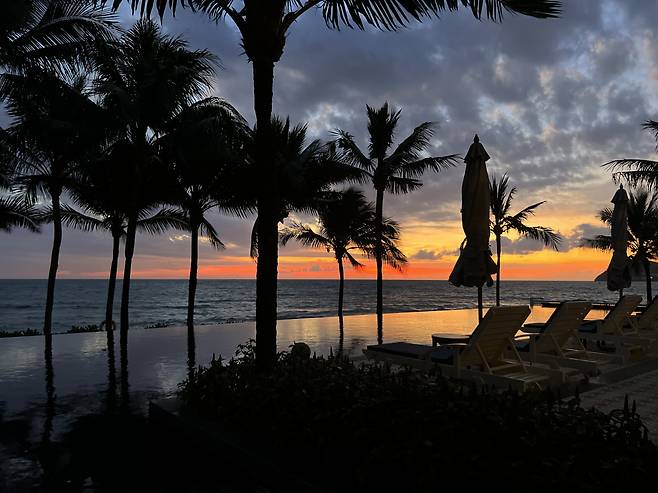 The sun rises over the beach in front of JW Marriott Phu Quoc Emerald Bay Resort & Spa. (Park Jun-hee/The Korea Herald)