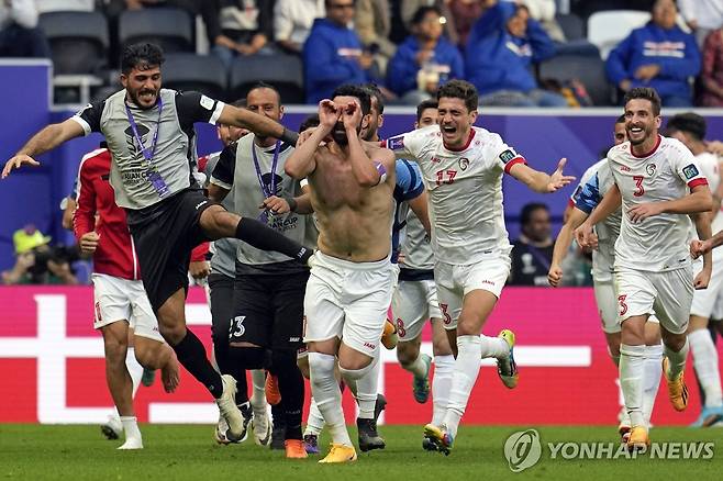 결승골을 넣고 기뻐하는 시리아 선수들 [AP=연합뉴스]