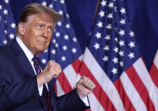 Former U.S. President Donald Trump gives a fist bump to supporters ahead of the announcement of the results of the New Hampshire Republican primary in New Hampshire, U.S., January 23. Reuters