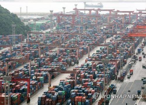 Containers are stacked at a pier in Korea's largest port city of Busan on July 4, 2023. [YONHAP]