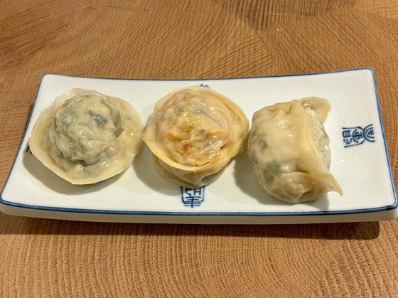 From left,meat, kimchi and seafood mandu at Kkangtong Mandu in Jongno District, central Seoul [LEE JIAN]