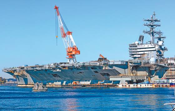 Nimitz-class nuclear-powered aircraft carrier USS Ronald Reagan (CVN-76) oft the U.S. Navy’s Seventh Fleet docked at the Yokosuka Naval Base in Japan, for maintenance on Dec. 6, 2023. [WOO SANG-JO]