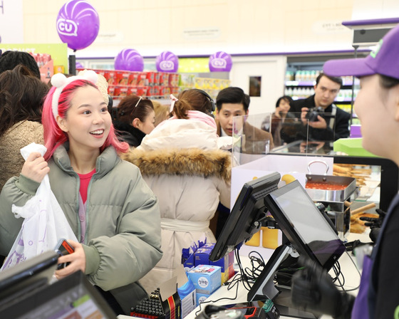 A customer shops at CU Astana Square in Kazakhstan, which opened on Wednesday [BGF RETAIL]