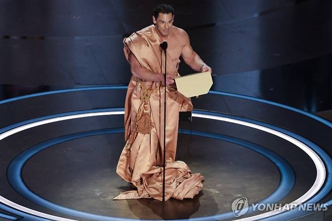 John Cena performs on stage during the presentation of the Oscar for Costume Design on stage during the Oscars show at the 96th Academy Awards in Hollywood, Los Angeles, California, U.S., March 10, 2024. REUTERS/Mike Blake