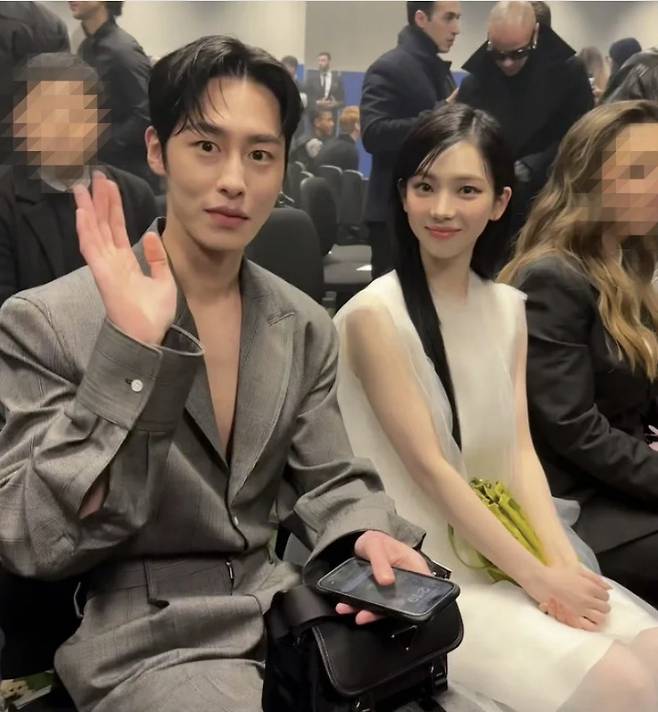 Lee Jae-wook (left) and Karina attend Prada’s 2024 fall-winter men’s collection show in Milan on Jan. 14. (Prada)