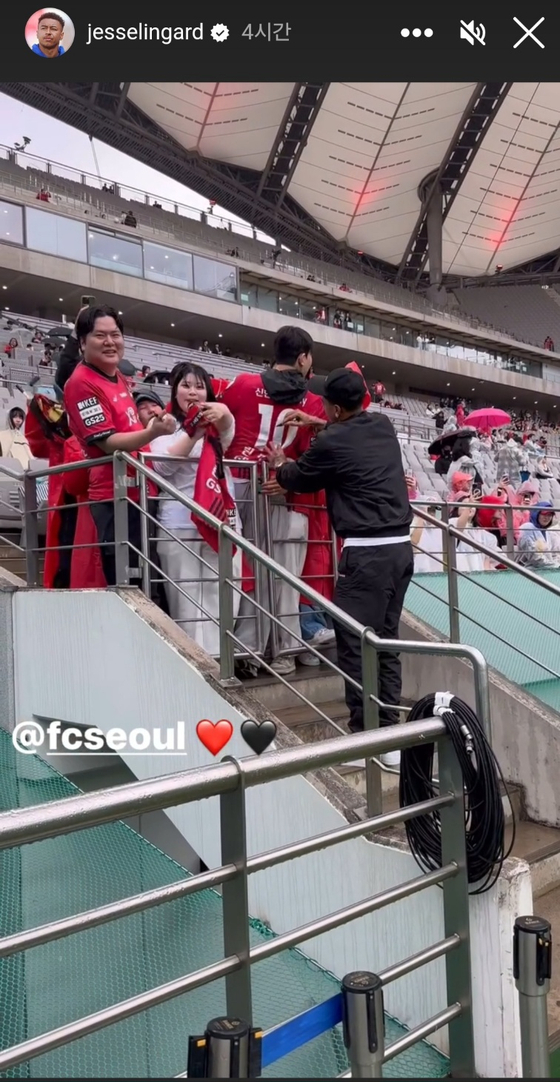 FC Seoul midfielder Jesse Lingard, in black, signs an autograph at Seoul World Cup Stadium in western Seoul in a photo shared on his Instagram story on Saturday. [SCREEN CAPTURE]
