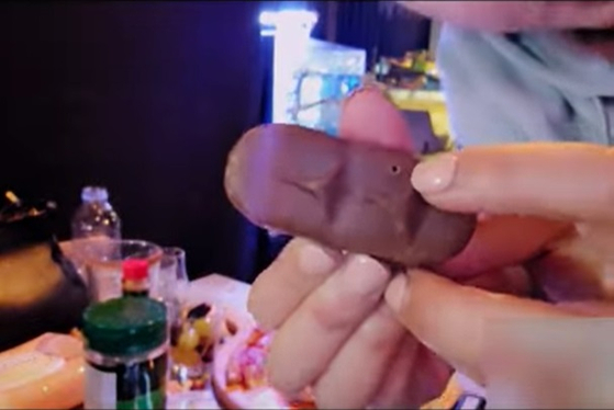 The Youtuber, who goes by the channel name Shinning Gagyeong, points out what she believes could be an injection mark in the chocolate. [SCREEN CAPTURE]