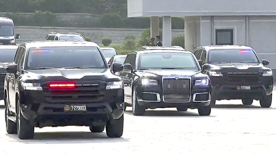North Korean leader Kim Jong-un's armored Aurus limousine, center, gifted by Russian President Vladimir Putin, is surrounded by six Toyota Land Cruiser 300s last week. [YONHAP]