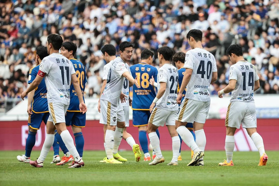 Gimcheon Sangmu, in white, react after a draw with Ulsan HD in the K League 1 match at Ulsan Munsu Football Stadium in Ulsan in a photo shared on Gimcheon's official Instagram account on Sunday. [SCREEN CAPTURE]