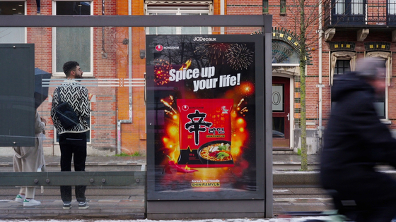 An advertisement for Nongshim's flagship Shin Ramyun is displayed at a bus stop in the Netherlands. [NONGSHIM]