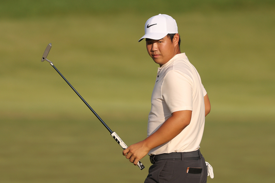 Tom Kim reacts on the 18th green during the first round of the 2024 PGA Championship at Valhalla Golf Club in Louisville, Kentucky on Thursday. [GETTY IMAGES]