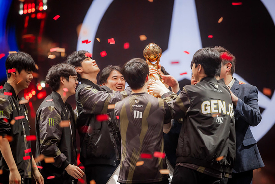 Members of League of Legends team Gen.G lift the trophy after winning the 2024 Mid-Season Invitational in Chengu, China on Sunday. [RIOT GAMES]