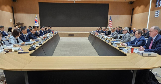 The second round of negotiations between South Korea and the United States on sharing the costs for the upkeep of the 28,500-strong U.S. troops in South Korea, starting in 2026, is held at the Korea Institute for Defense Analyses in eastern Seoul on Tuesday. [YONHAP]