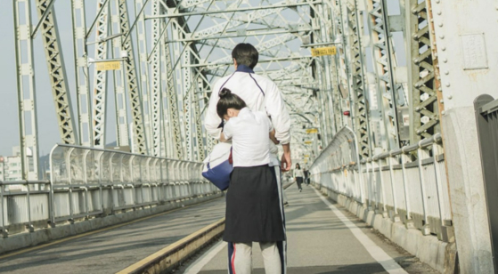 A scene from ″Lovely Runner″ shot at Geumgang Bridge in Suwon, Gyeonggi [TVN]