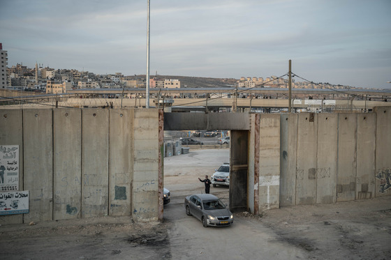 An Israeli officer directing traffic at the Qalandia checkpoint between Ramallah, in the Israelioccupied West Bank, and Jerusalem on Dec. 3, 2023. Spain, Norway and Ireland said on May 22, 2024 that they would recognize an independent Palestinian state, a rebuke to Israel over its war in Gaza and its decades of occupation of Palestinian territories. [Sergey Ponomarev/The New York Times]