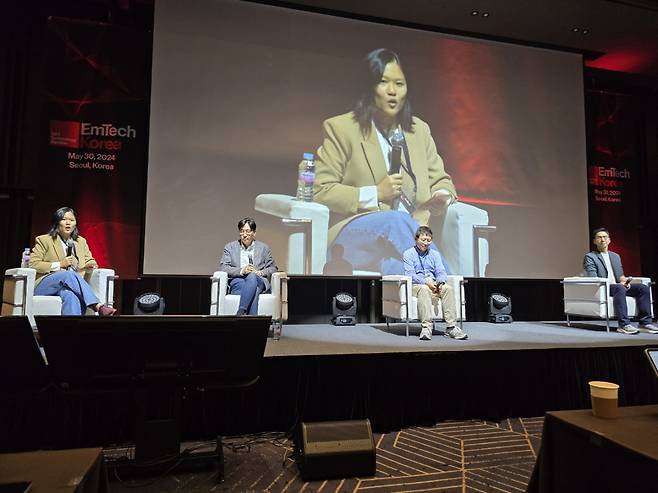 Karen Hao (far left), a contributing writer for The Atlantic, speaks during a discussion session, titled "The Rise of Super-Intelligent Agents," at the EmTech Korea conference held in Seoul on Thursday. On her left is Yoon Kim, a partner at Saehan Ventures; Tong Zhang, a professor at the University of Illinois Urbana-Champaign; and Lee Moon-tae, a fundamental research leader at LG AI Research. (Jie Ye-eun/The Korea Herald)