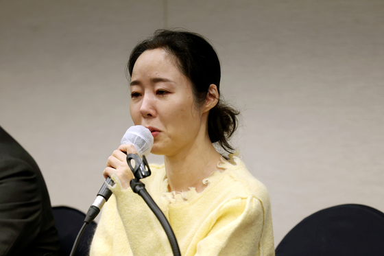 ADOR CEO Min Hee-jin smiles during Friday's press conference. [JOINT PRESS CORPS]