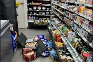 Drinks spill from the shelves of a convenience store in Hangan-myeon, North Jeolla Province, following a 4.8-magnitude earthquake in  Buan, North Jeolla Province, on Wednesday.