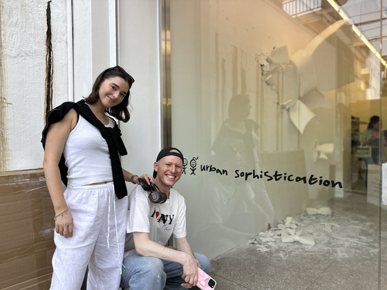 Neta Yam, left, and Elad Yam, founders of Urban Sophistication, pose for a photo in front of the brand's Seoul Art Pop-Up on June 14 after an interview with the Korea JoongAng Daily. [SEO JI-EUN]