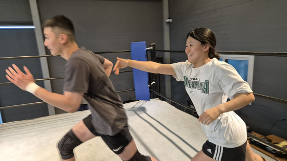 Mary, right, is very excited to be living out her bounce house dreams, seconds before she falls. [PWS KOREA]