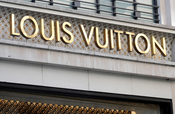 The Louis Vuitton logo is seen outside a store on the Champs-Elysees in Paris, France, in 2020. [YONHAP/REUTERS]