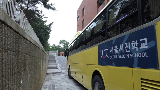 A still image from the film ″A Long Way to School″ shows a shuttle bus of Seojin School running on school days after it opened last year. [JINJIN PICTURES]