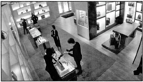 A screen capture of surveillance camera footage that allegedly shows an NIS handler purchasing a designer handbag for Terry in 2021. [UNITED STATES DISTRICT COURT SOUTHERN DISTRICT OF NEW YORK]