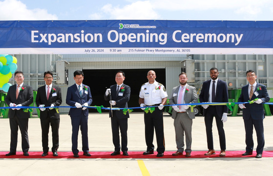 Executives of HD Hyundai Electric take a photo at a ceremony marking the completion of a construction of a power transformer storage facility in Alabama on July 26. [HD HYUNDAI ELECTRIC]