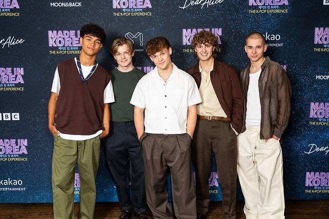 From left: SM Entertainment's first British boy group Dear Alice members Dexter Greenwood, James Sharp, Blaise Noon, Oliver Quinn, and Reese Carter pose for a photo during the press conference held at the Soho Hotel in London, Thursday, local time. (Yonhap)