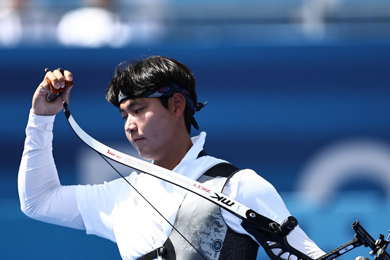 Lee Woo-seok reacts after winning bronze in the men's individual archery contest at the Paris Olympics on Sunday. [REUTERS/YONHAP]