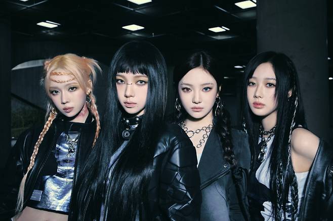 Karina (second from left) of Aespa is seen in the promotional photo for their latest album "Armageddon" (SM Entertainment)