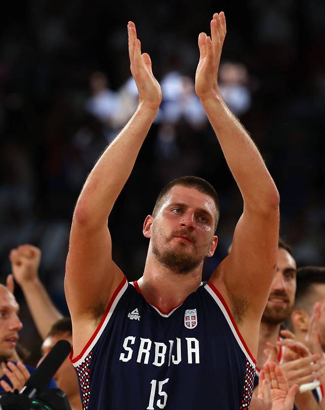 Paris 2024 Olympics - Basketball - Men's Bronze Medal Game - Germany vs Serbia - Bercy Arena, Paris, France - August 10, 2024. Bronze medallist Nikola Jokic of Serbia celebrates celebrates the team's win. REUTERS/Brian Snyder







<저작권자(c) 연합뉴스, 무단 전재-재배포, AI 학습 및 활용 금지>