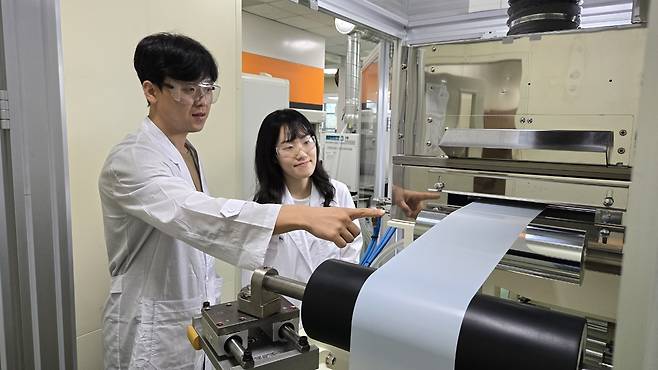 Researchers at SK IE Technology assess battery separators in the lab at the company's R&D center in Daejeon. (SK Innovation)