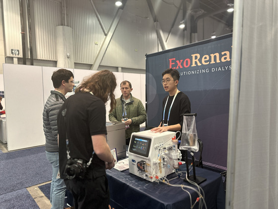 An employee at ExoRenal explains about its two flagship devices for portable hemodialysis at the CES 2024 in Las Vegas in January. [EXORENAL]