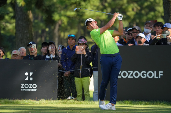 Collin Morikawa hits his tee shot on the 5th hole during the third round of Zozo Championship at Accordia Golf Narashino Country Club on Oct. 21, 2023 in Chiba, Japan. [GETTY IMAGES]