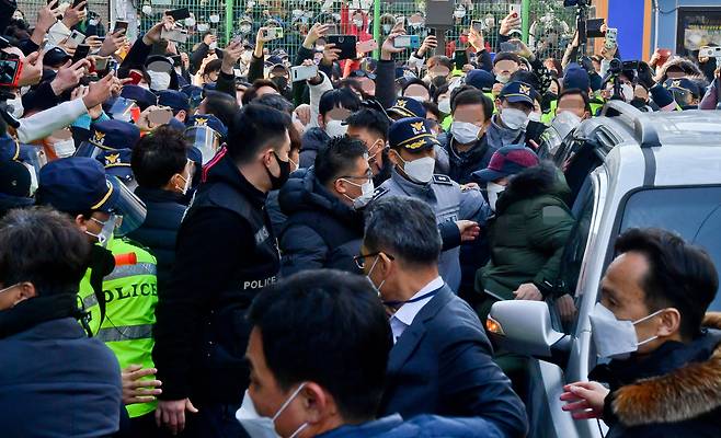 People wait near Cho Doo-soon's residence in Gyeonggi Province, Korea on Dec. 12, 2020 after he was released serving 12 years in prison. (Joint Press Photo)