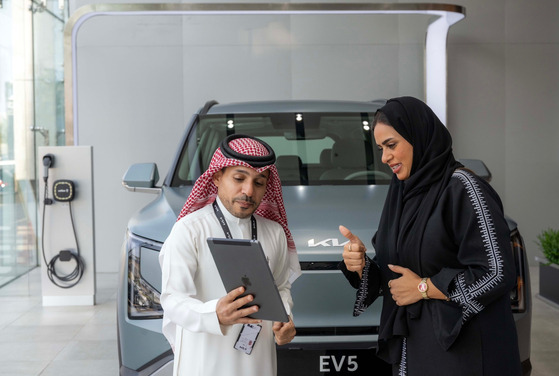 A customer looks at a Kia at a showroom in Jeddah, Saudi Arabia. [KIA]