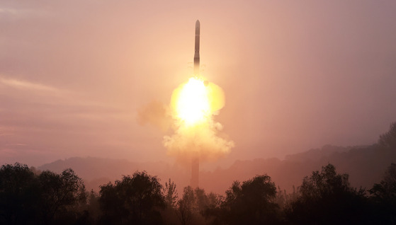 A Hwasong-19 intercontinental ballistic missile begins to take off in this photo released by the Workers' Party official newspaper Rodong Sinmun on Friday, a day after the launch. [NEWS1]