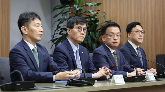 From left: Financial Supervisory Service Gov. Lee Bok-hyun, Bank of Korea Gov. Rhee Chang-yong, Finance Minister Choi Sang-mok and Financial Services Commission Chairman Kim Byoung-hwan at a senior official meeting on macroeconomic issues held at the Export-Import Bank of Korea in western Seoul on Friday. [JOINT PRESS CORPS]