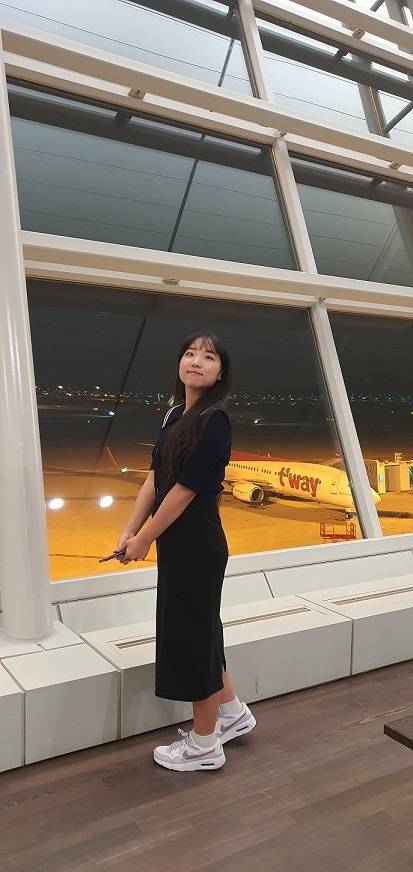 Kim poses for a photo near a boarding gate at Incheon Internation Airport before embarking on her honeymoon. (Courtesy of Kim)
