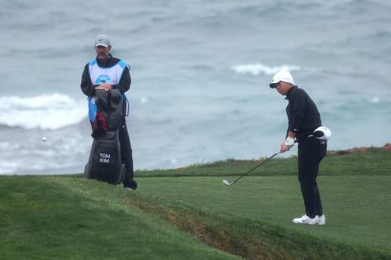 Tom Kim plays a shot on the ninth hole during the third round of the AT&T Pebble Beach Pro-Am 2025 at Pebble Beach Golf Links on Feb. 1 in Pebble Beach, California. [GETTY IMAGES]