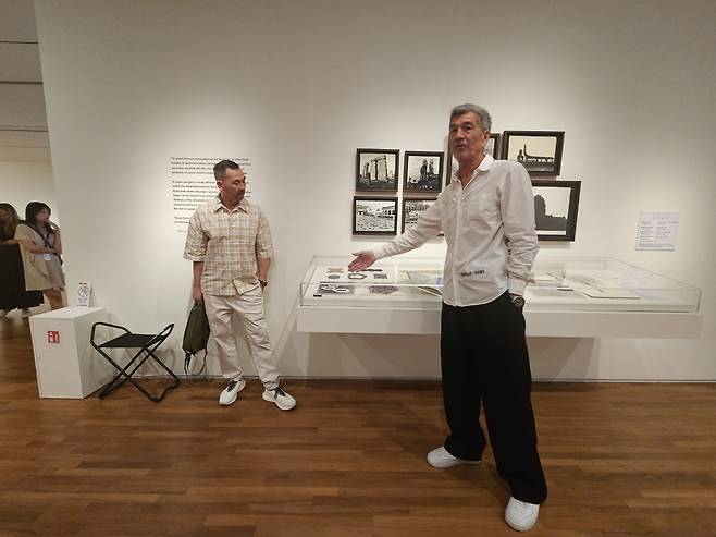 Alex Turnbull (right) and Johnny Turnbull give a press tour on Jan. 15 for the exhibition “Kim Lim: The Space Between” at the National Gallery of Singapore. (Park Yuna/The Korea Herald)